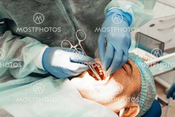 The patient in the dentists chair at the time of...