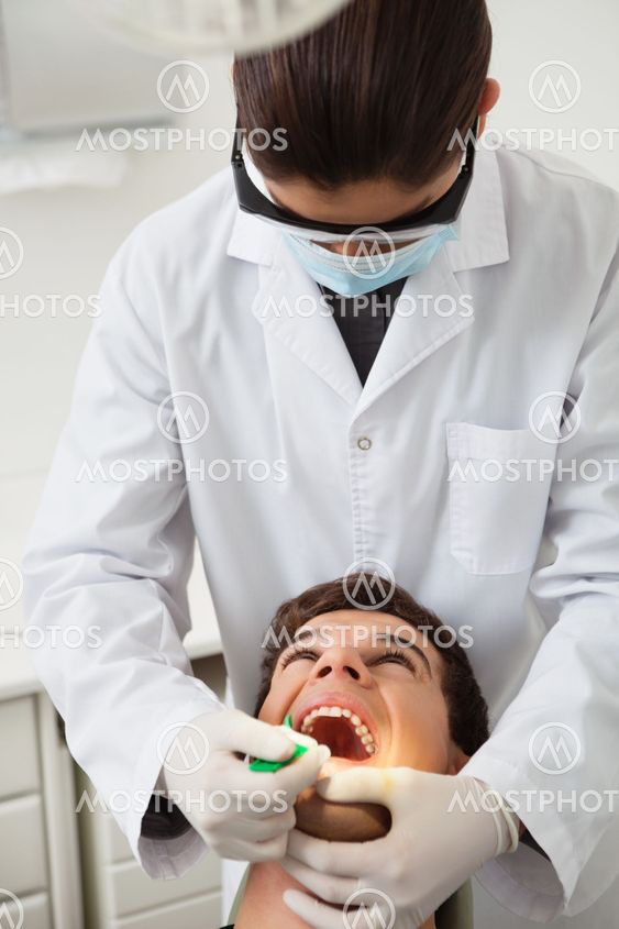 Patient having his teeth examined