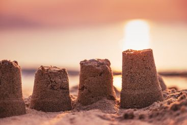 Sand castle at the seaside beach