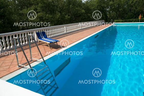 blue bed near the swimmingpool
