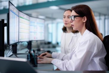 young female medical coder maintaining billing spreadsheets