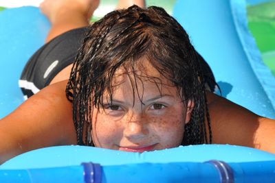 young girl on air mattress 