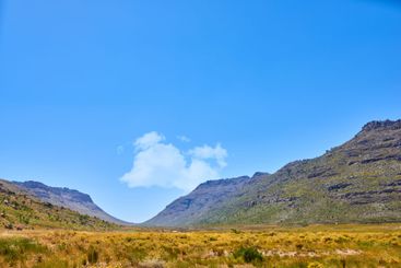 Blue sky, landscape and mountain with field in nature...