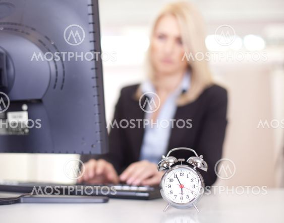 Beautiful businesswoman trying to meet a deadline