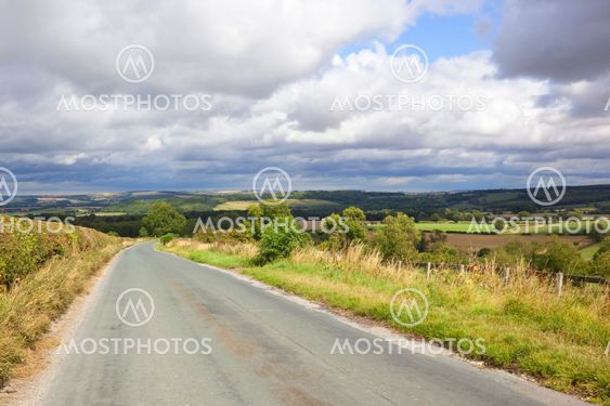 storm clouds over checkered hills