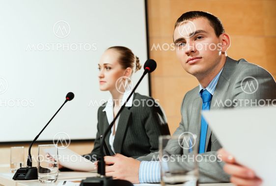 businessmen communicate at the conference