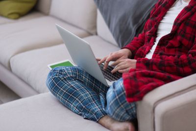 man freelancer in bathrobe working from home