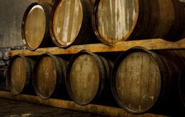 Rustic wooden barrels in the cellar.