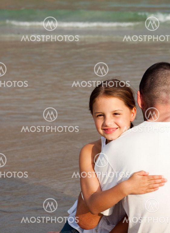 Portrait of a smiling Daughter Hugging his father