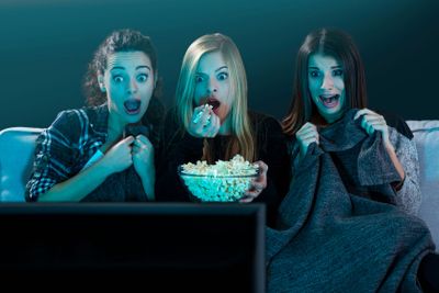 Scared teenage watching movies 