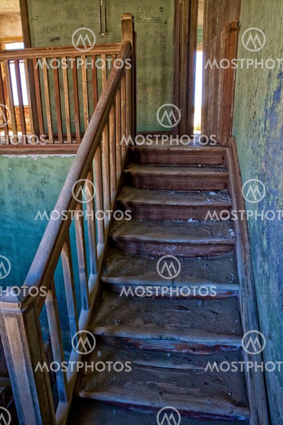 A staircase in a old house in kolmanskop namibia