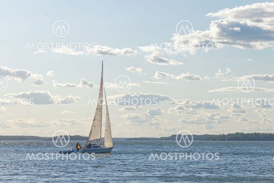 Sailboat sailing in windy sunny weather