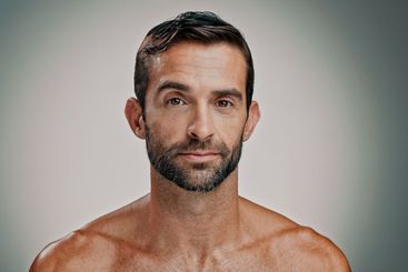 Beauty, skincare and portrait of man in studio for...