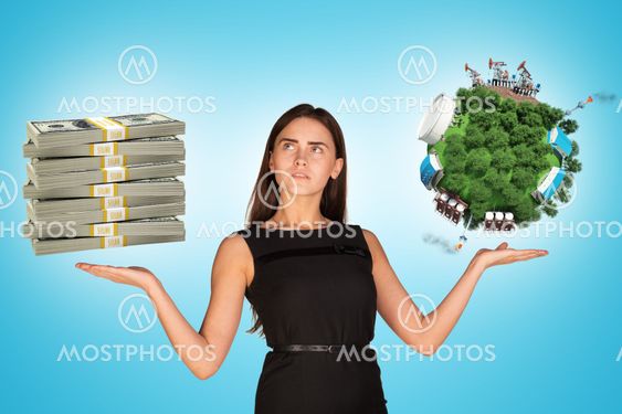 Businesswoman holding cash and earth globe
