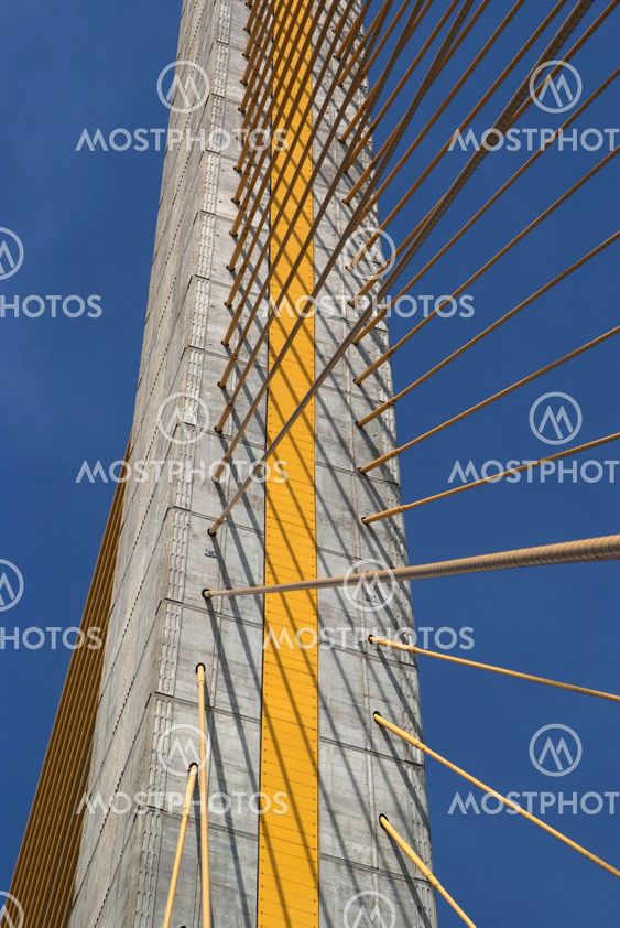Detail of bridge construction over blue sky