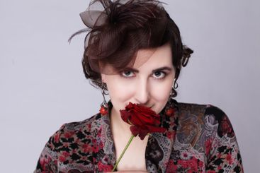 Sensual brunette woman in red hat retro style fashion...