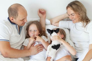 Cheerful family relaxing on the couch together at home