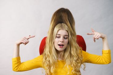 Two girls creating hairdo. Hair ombre color