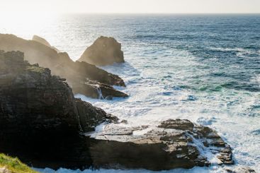 Rough and rocky shore at Malin Head, Ireland's...