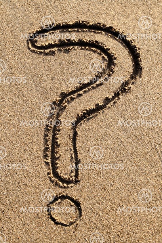 The questionmark symbol drawn in the sand.