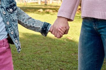 Girl, mother and holding hands in nature, childhood...