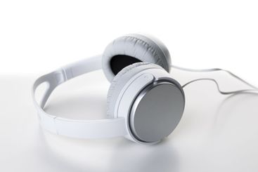 White headphones on white background close up