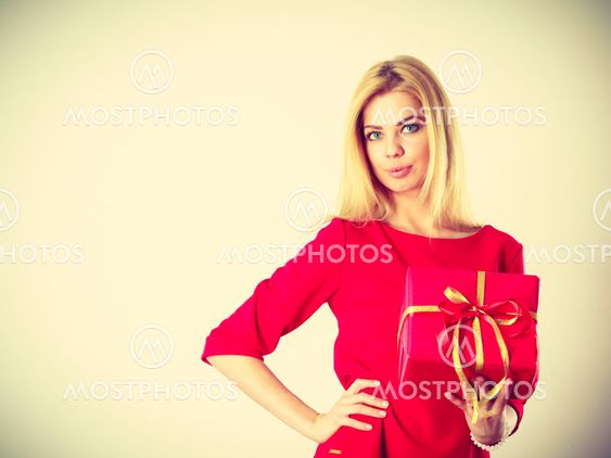 Beautiful woman with red gift.