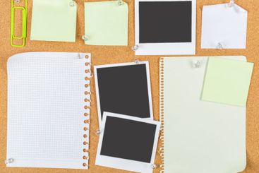 Collection of blank sticky notes and empty photo frames...