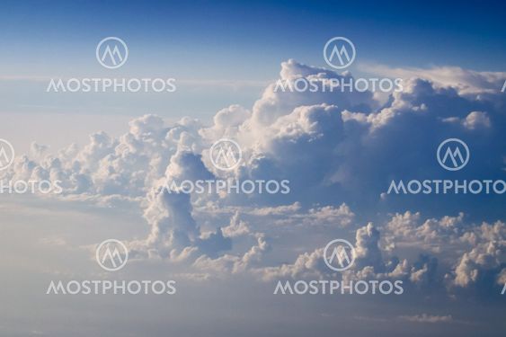 dramatic blue sky with clouds and sun rays