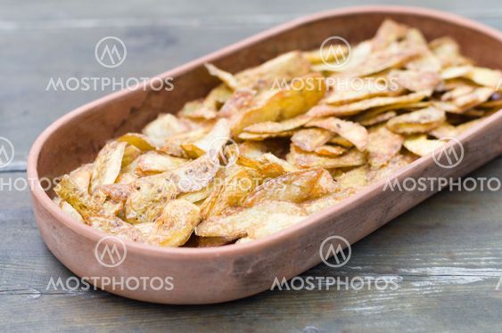 Crispy potato skins in crockery