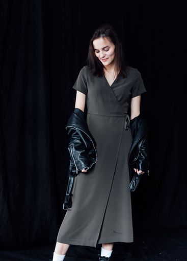 Beautiful fashionable slim woman in green summer and...