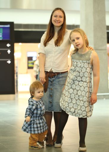 Happy mother and children indoors portrait
