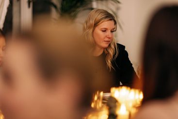 Young attractive women clink glasses of champagne.