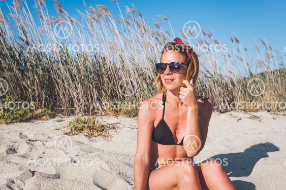 Young woman enjoying alone on the beach