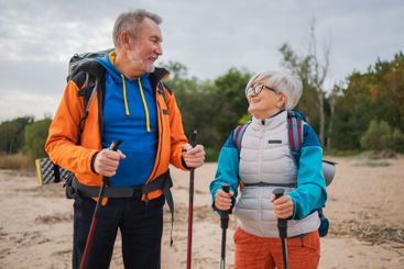 Hiking tourism adventure. Senior couple man woman...