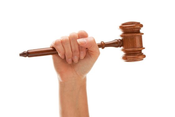 Woman Holding Wooden Gavel Isolated on White