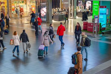 Travelers inside the Roma Termini railway station, in...