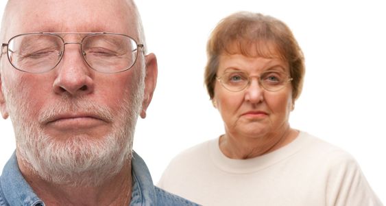 Concerned Senior Couple on White