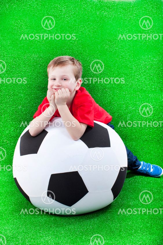 Happy young boy with soccer ball