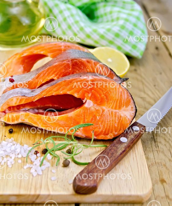 Trout with oil and knife on board