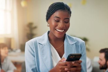 Laughing, happy or businesswoman in office with phone or...