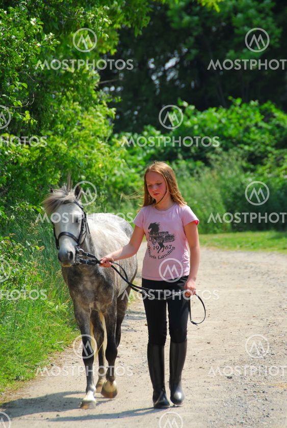 Girl walk pony