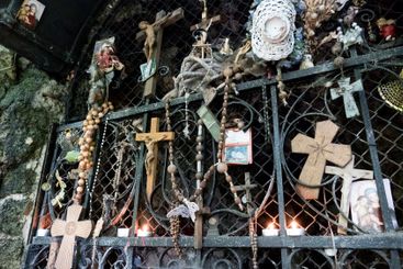Religious and Christian objects and candles on the...