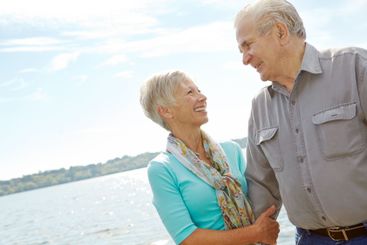 Smile, senior couple and blue sky on lake for support,...