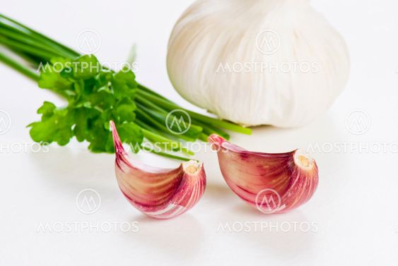 Cloves of garlic with herbs