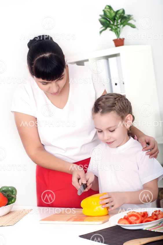 mom and daughter cooking together