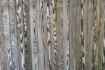 Unique patterns on weathered wooden planks in natural light