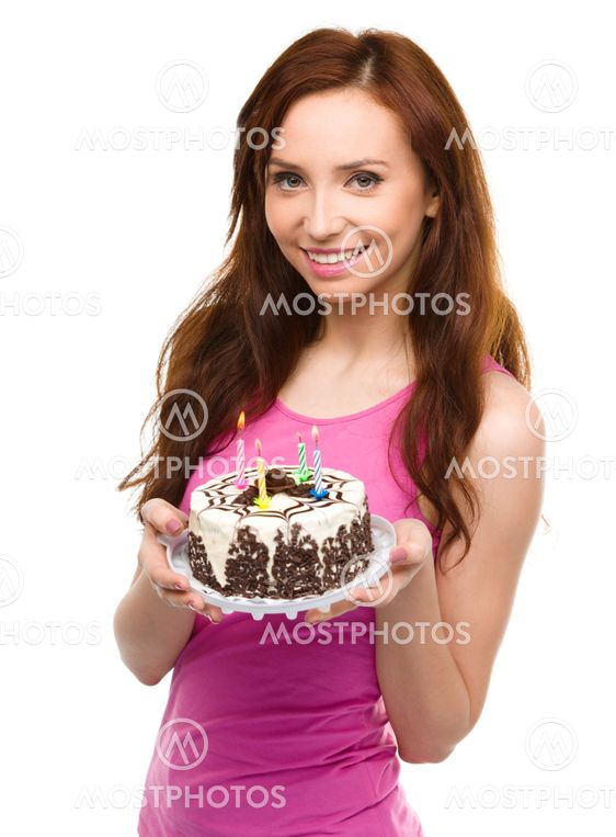 Young woman with anniversary cake
