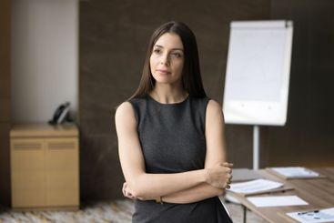 European millennial businesslady with serious and...