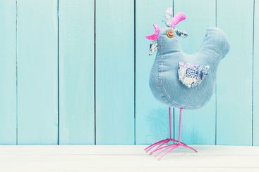 Cozy pastel wooden home decor objects on blue background